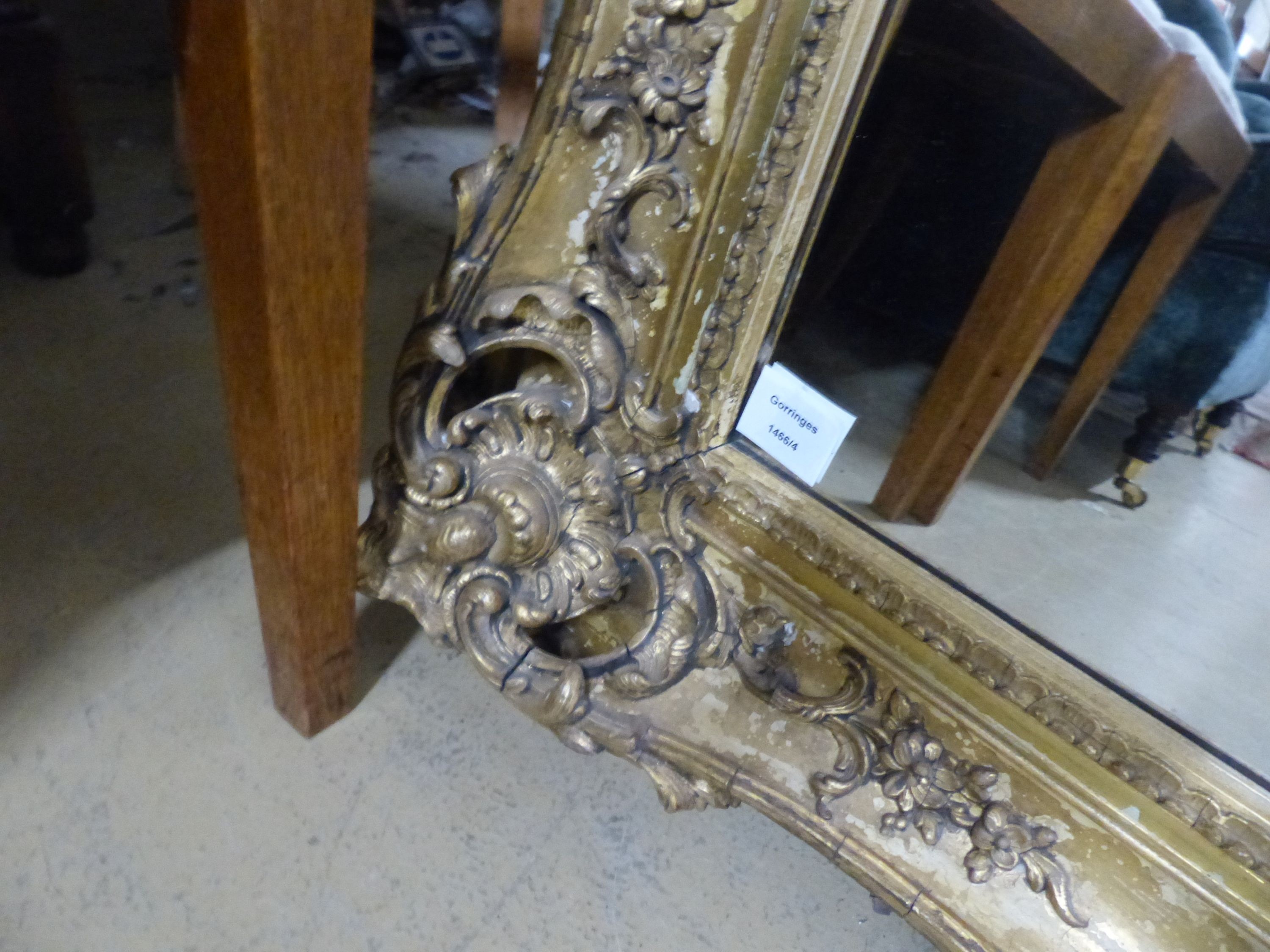 A Victorian giltwood and gesso rectangular wall mirror, (formerley a picture frame), W.110cm H.102cm